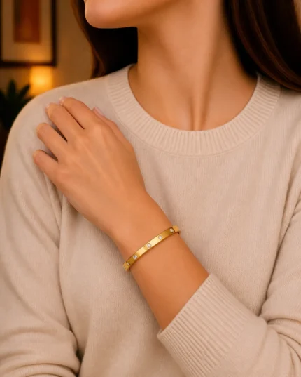 gold bangle with diamond look stones stone studded kara worn on wrist