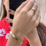 Zircon embedded handcuff bracelet worn on wrist