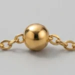 Gold bead payal for girls close-up showing the golden beads and lobster clasp