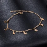 Gold star charms anklet coiled showing the golden star charms detail